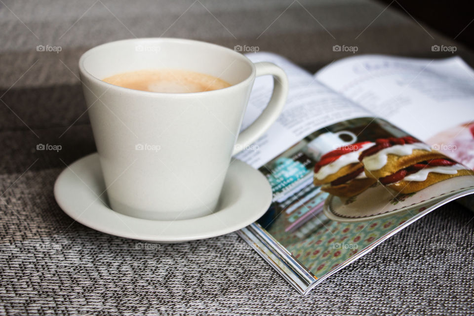 cup of coffee and a recipe book