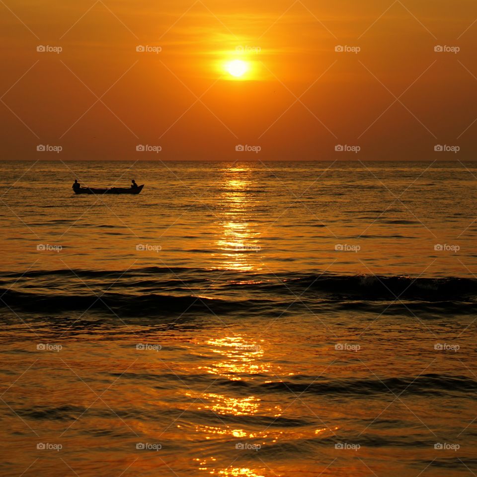 Sunset at beach is the warm view with cool feeling.