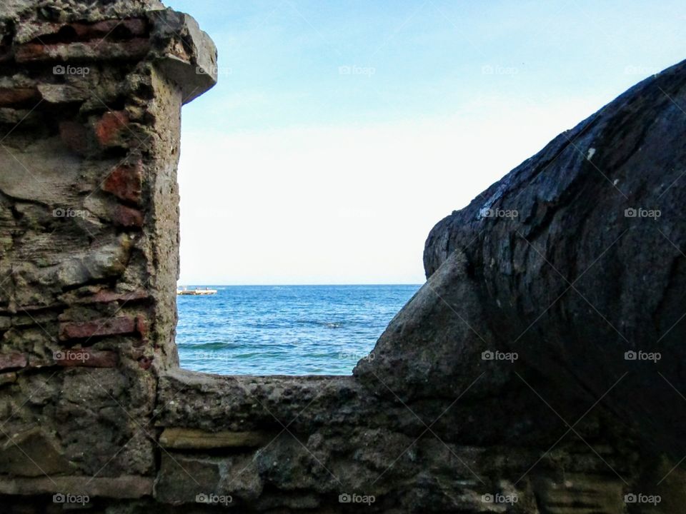a side view from a cannon of a spanish fortress in a caribbean island