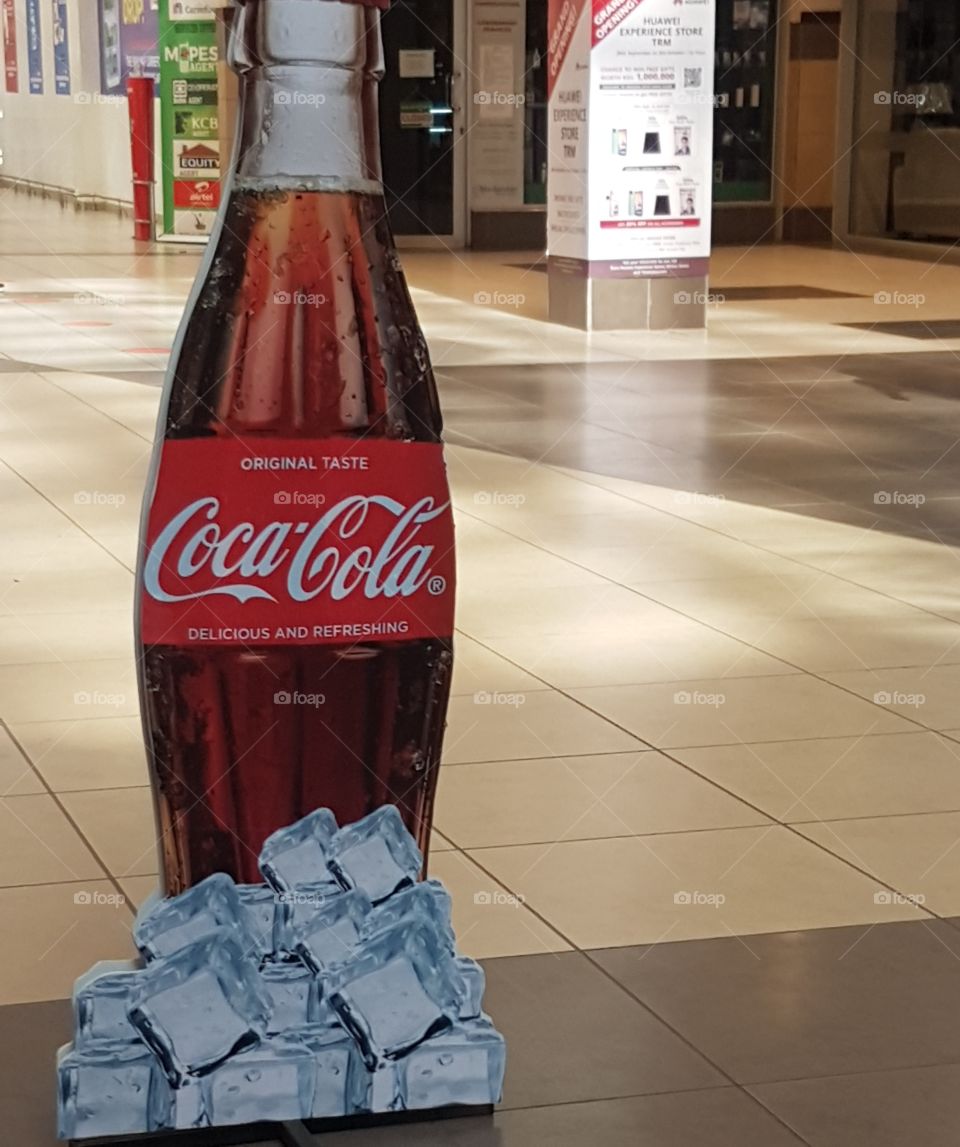 A coca-cola on ice as an advertisement