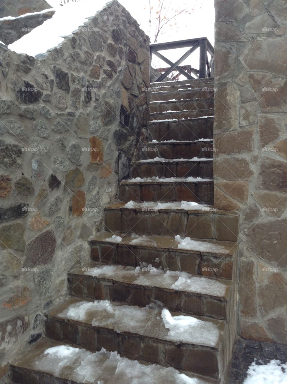 Stone staircase covered with snow