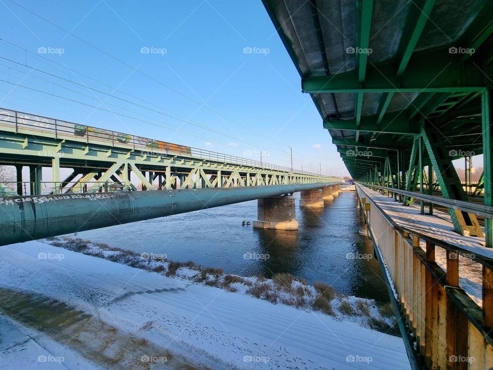 Lines: view from inbetween bridges over the Vistula River in Warsaw, Poland