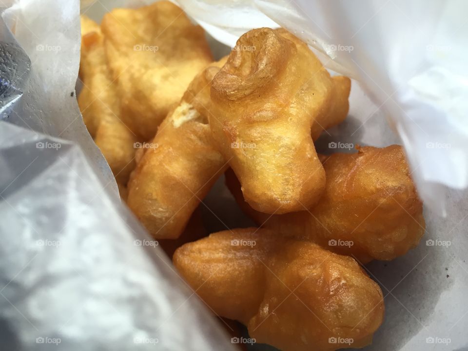 Deep-Fried doughstick in a bag. I'm in a hurry and I am hungry so this is my morning breakfast. It's fast, it's delicious and it's easy to eat :)