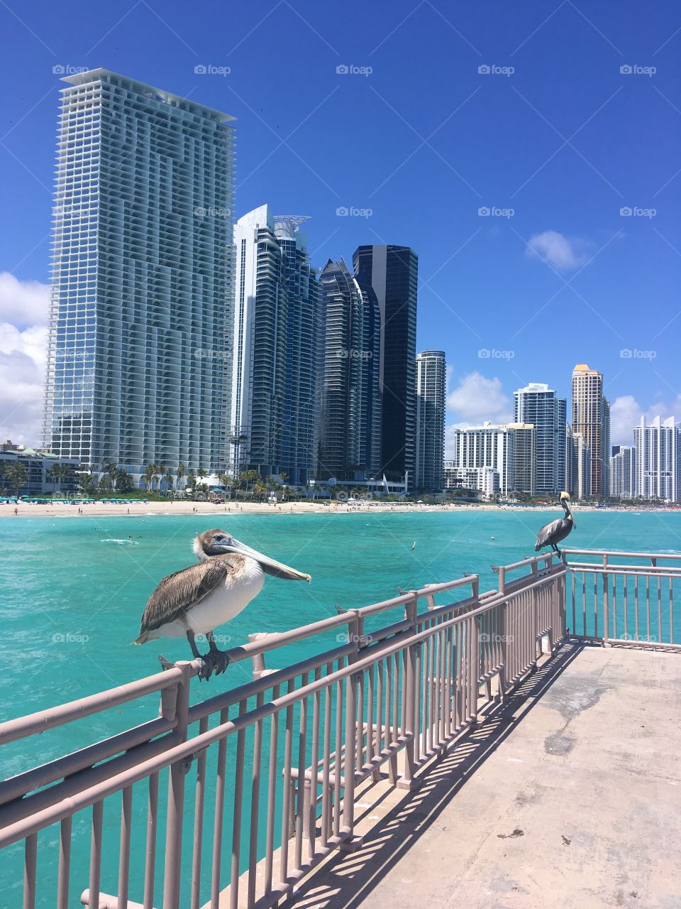 The beautiful turquoise waters of sunny isles, dramatically overlooked by the man made structures of modern day living!