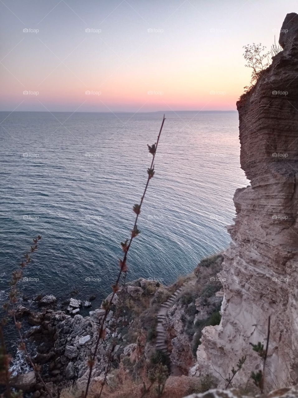 A cliff at sunset over the sea