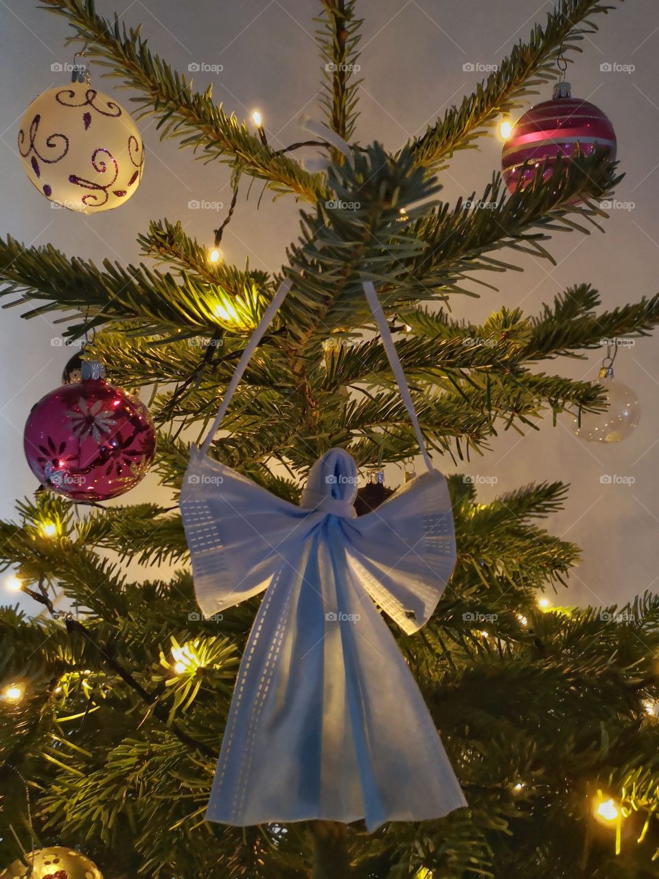 Face mask angel in christmas tree