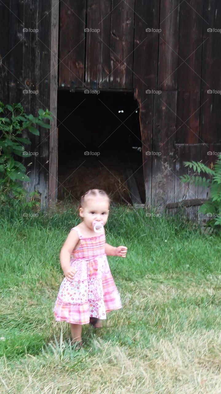 Old barn with little girl