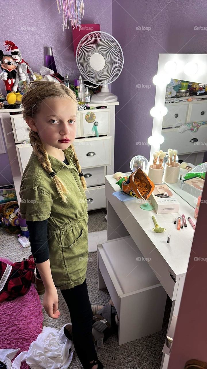 My niece trying out her Christmas gifts, lipsticks and her vanity. 