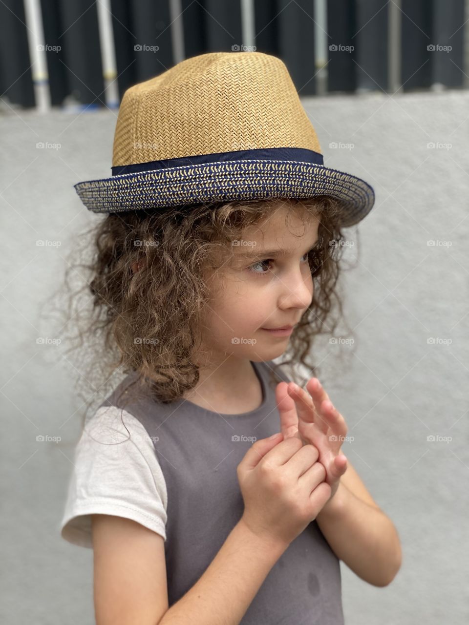 Curly girl and her hat