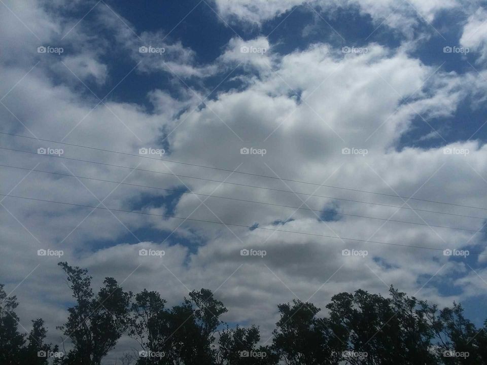 clouds passing by a broken heart.