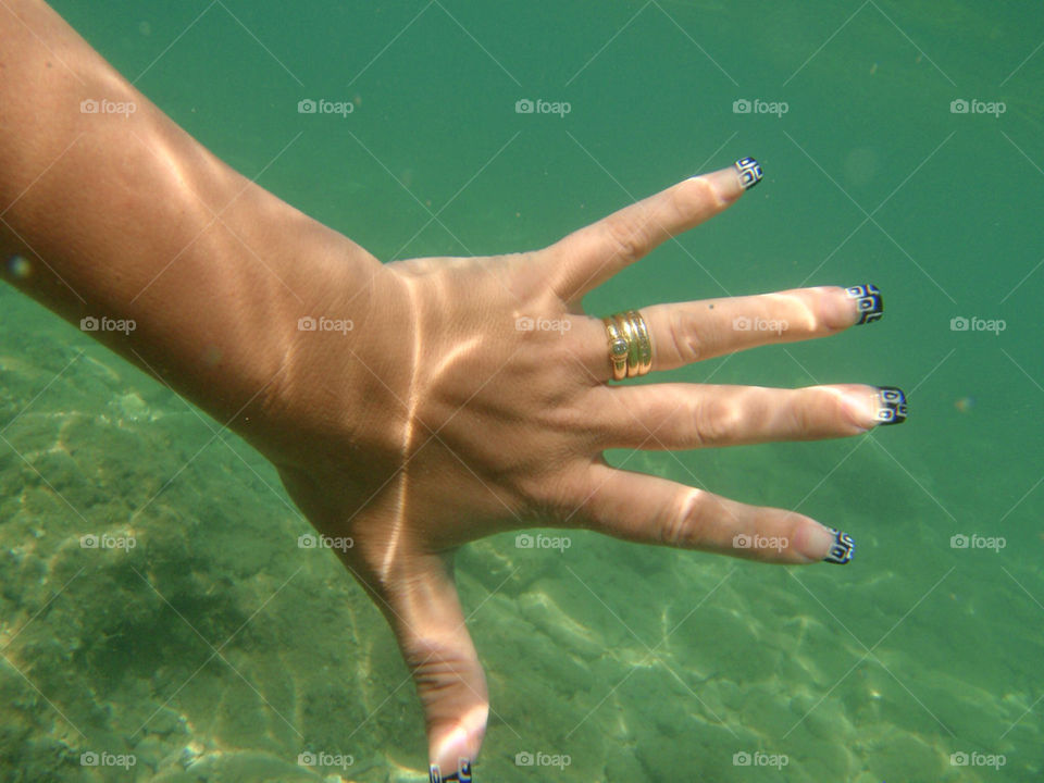 rings hand underwater by splicanka