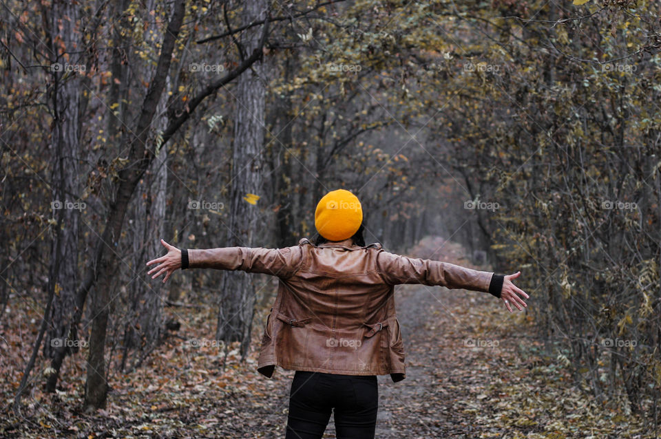 Happy fall season. A woman in the forest