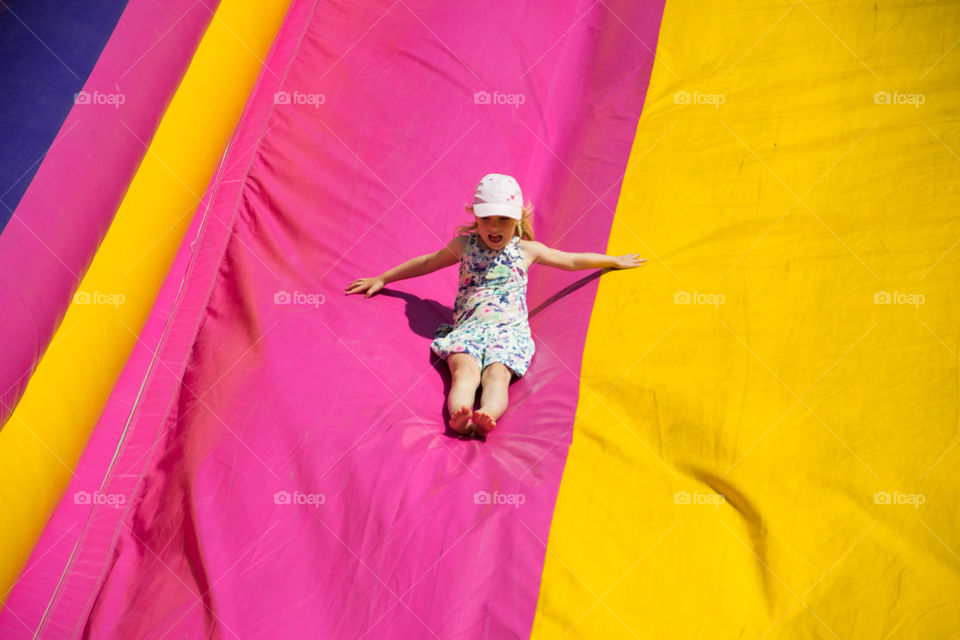 Slide and bouncy castle at a funfair in Malmö Sweden.