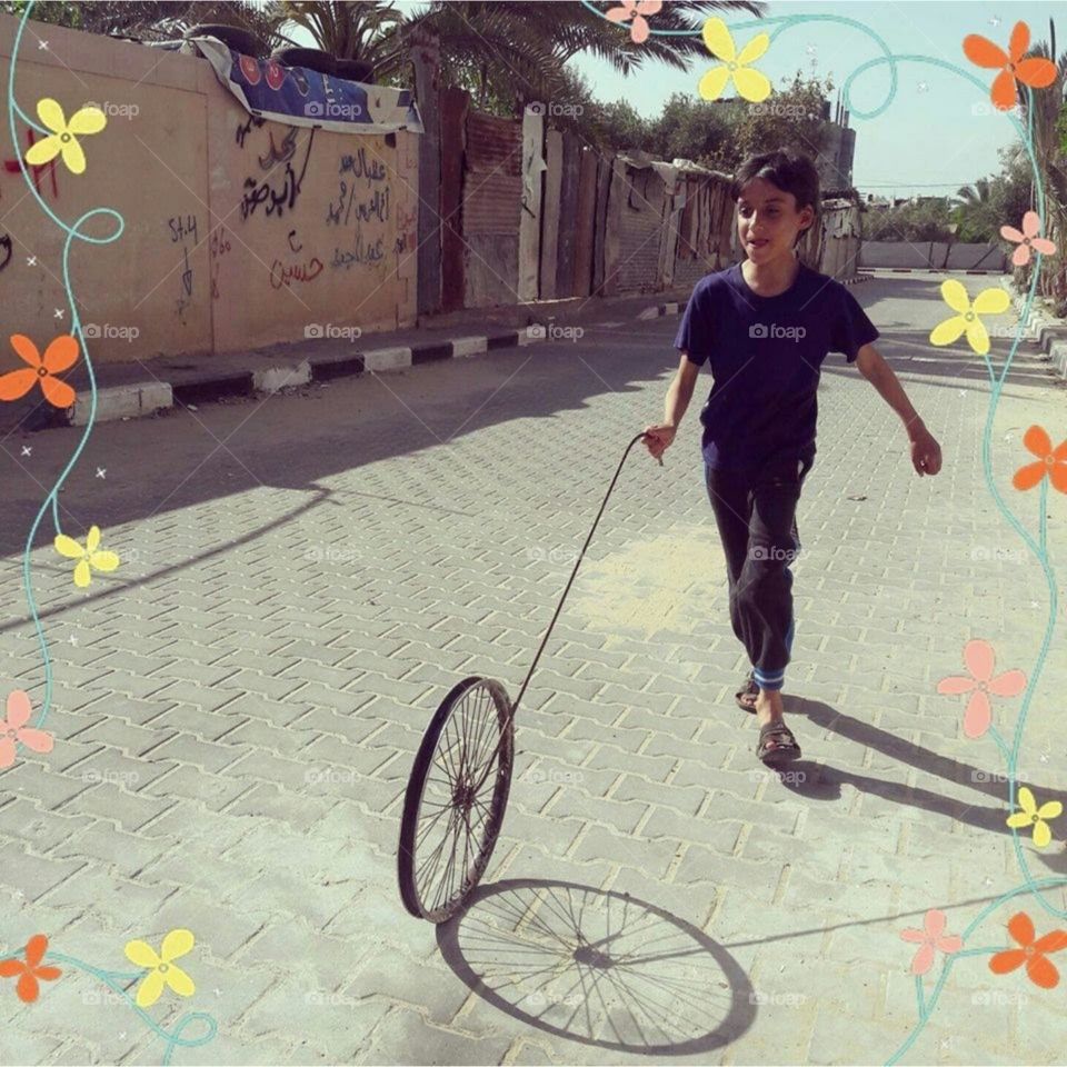 This game is for the poor. A picture I took for my little son. I can't buy him a bike, but I made this calf for him. It was a fun game.