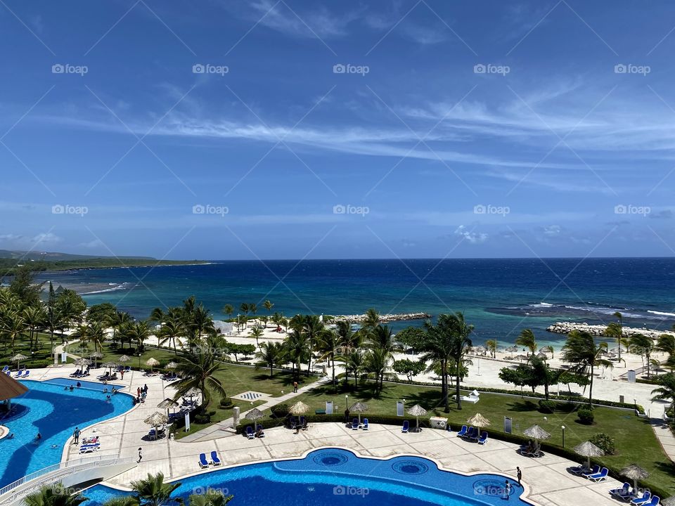 View of the pool and the ocean from the Bahia Principe Grand Jamaica hotel 