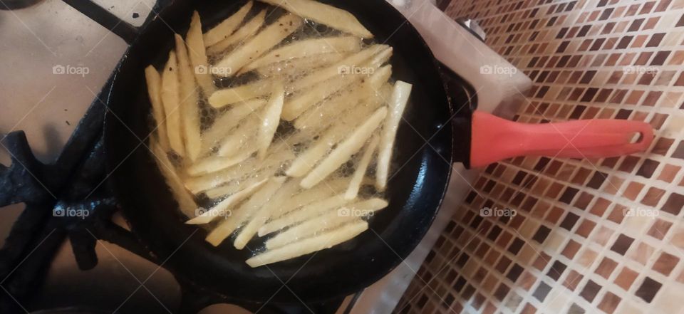 potatoes into frying pan