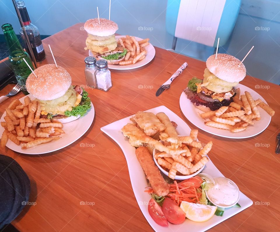 Delicious monster burgers and a seafood platter from breakers restaurant. I couldn't open my mouth wide enough to bite the burger they were that huge.! Yum!