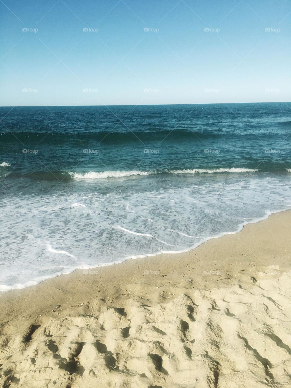Waves On Sandy Beach