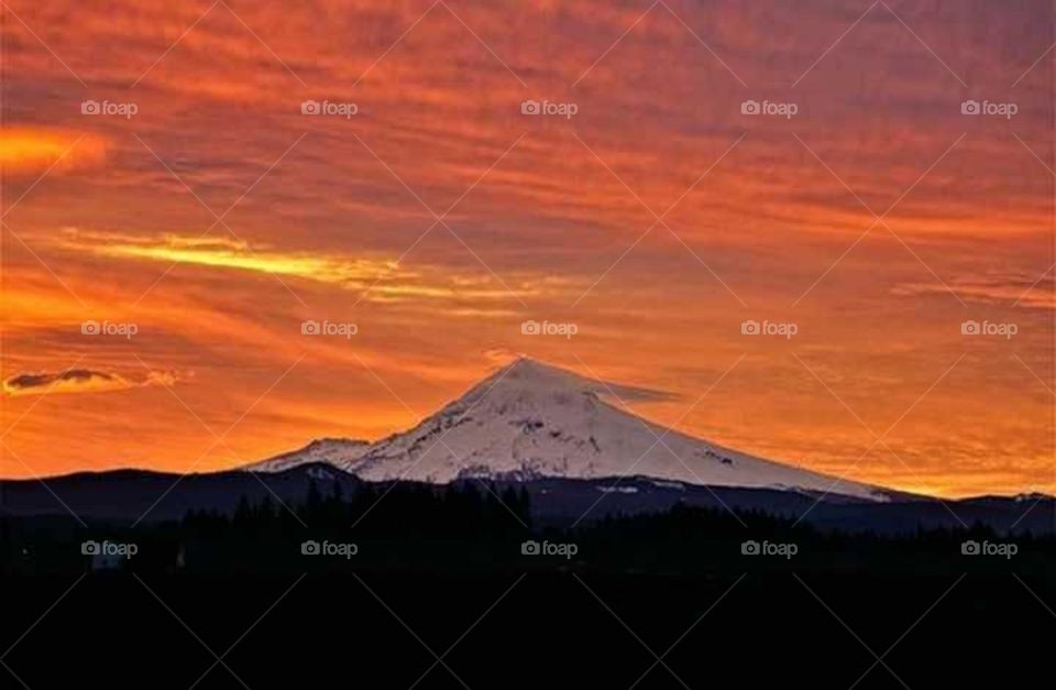 sunset on the snow top mountain