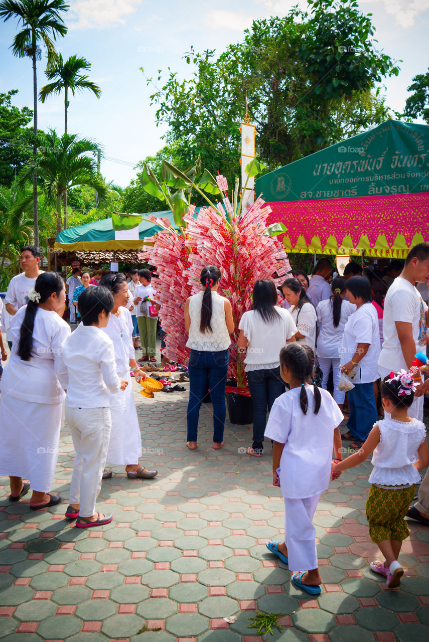 Buddhist temple fair. Faithful Buddhist donate to their temple