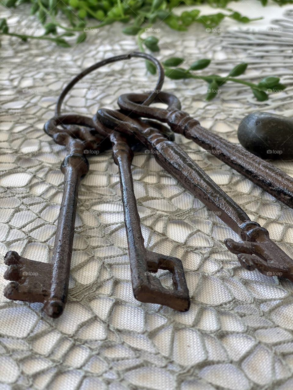 rusty old keys on white table