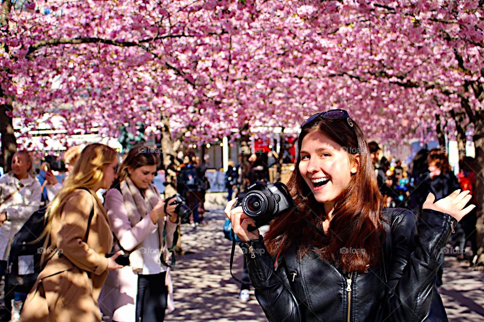 Portrait of woman with camera