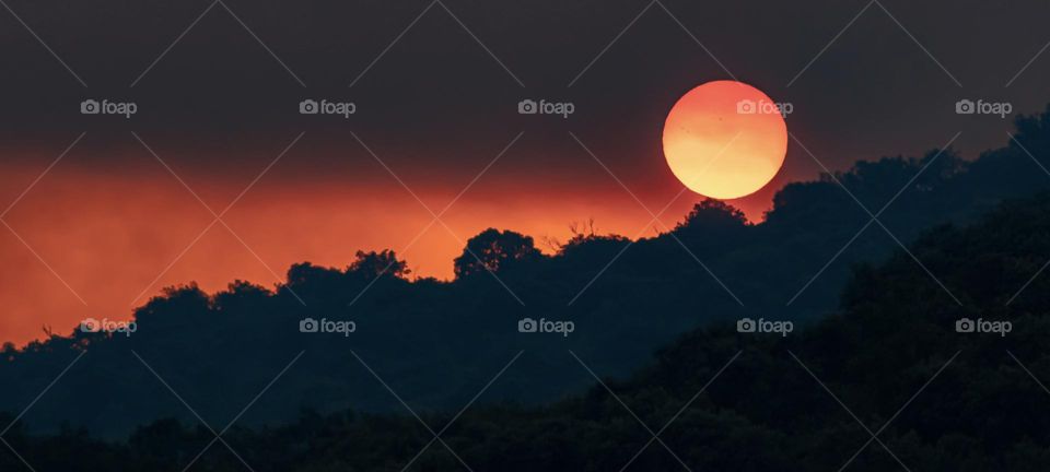 Smoke from wildfires in Portugal obscures the sunset