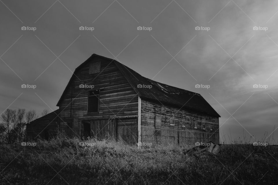 Black & White Barn. An abandoned barn on the praises.