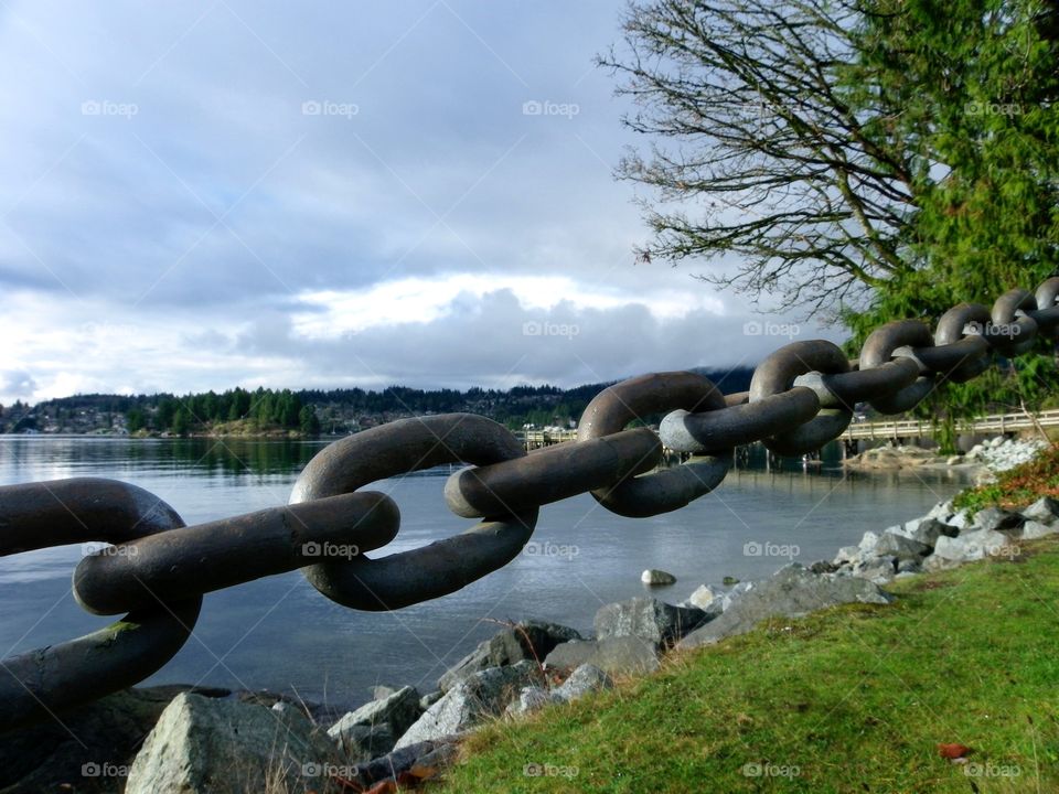 Chain Link Barrier. Love the effect of the rope chain against the cove scene