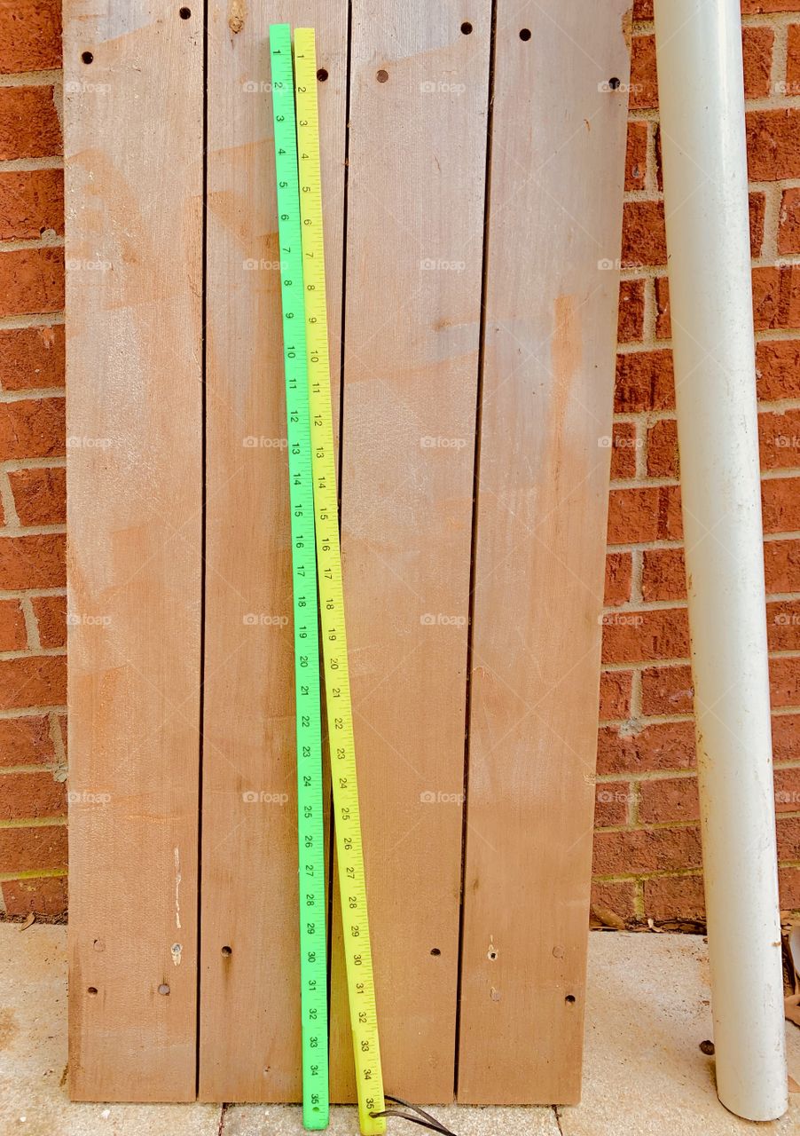 Y - Two Yardsticks - I use this while gardening to measure the distance between plants. It is  a graduated measuring stick three feet (0.9144 meter)long, a standard basis of calculation