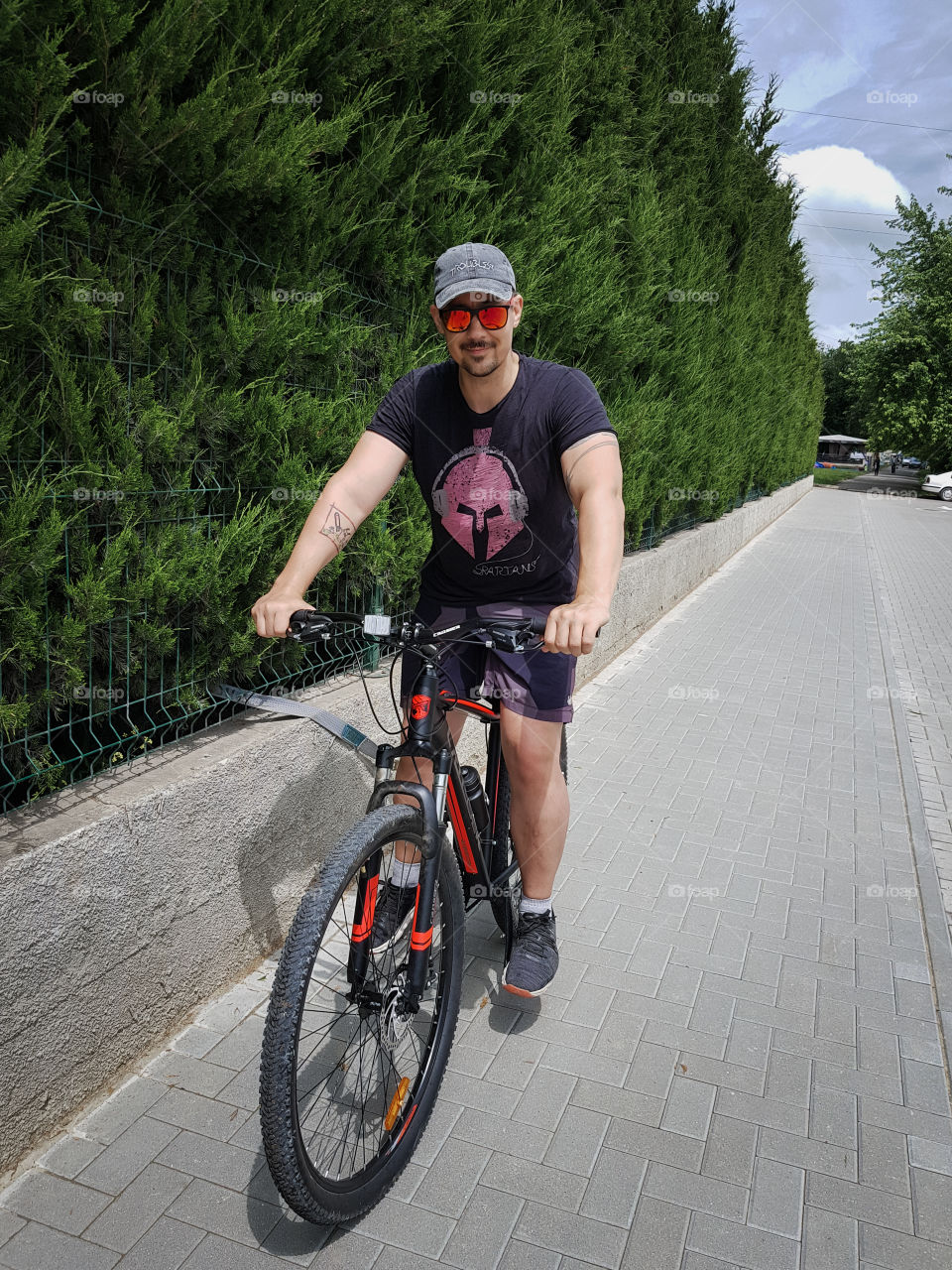 Adult young man on bike.