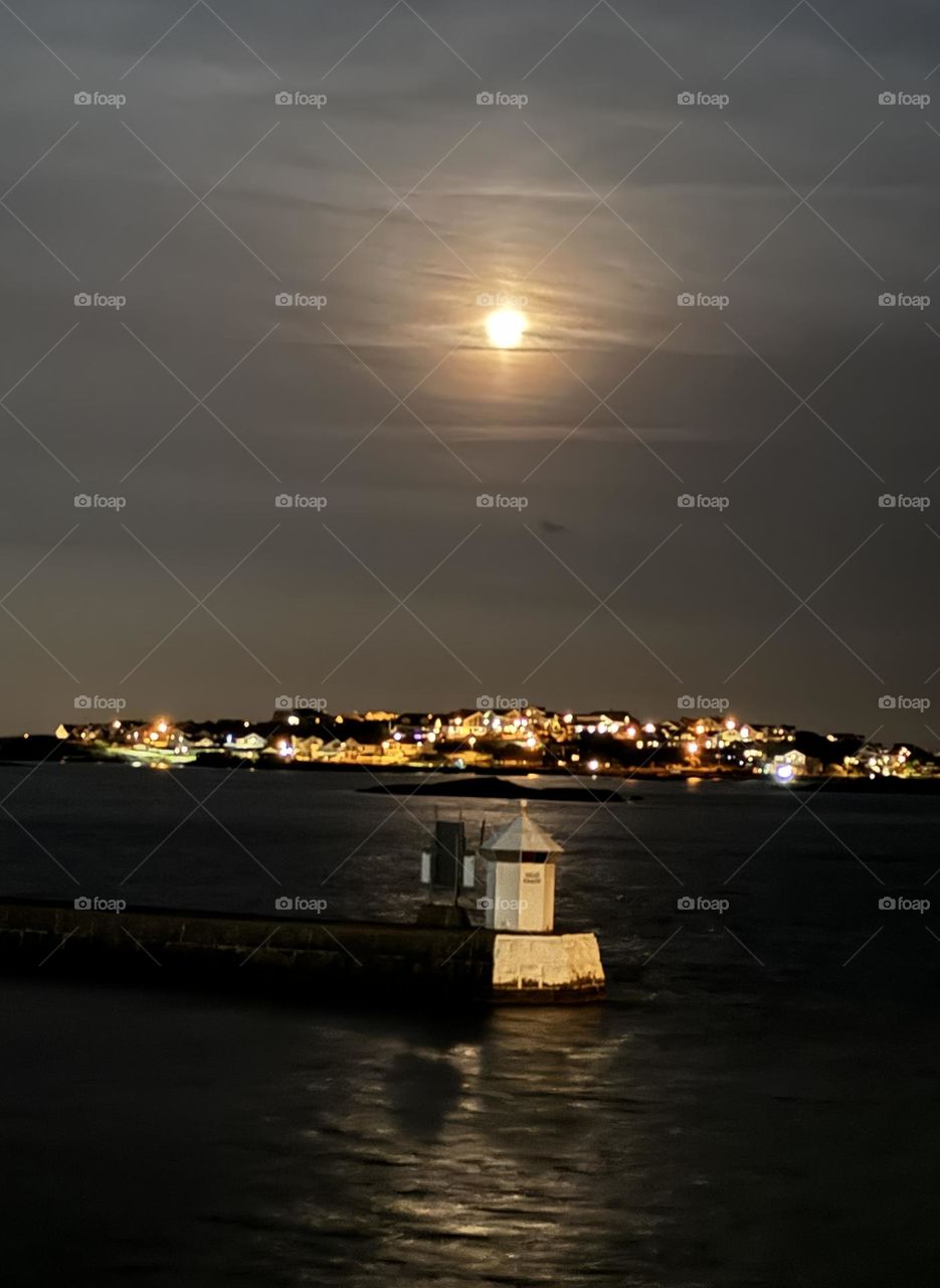 Full moon over the island and lighthouse 