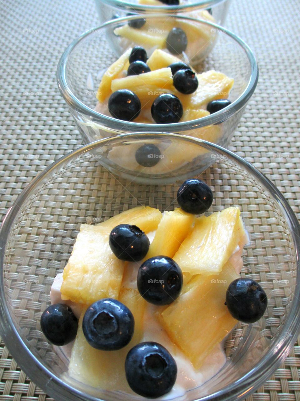 Healthy desserts of Greek yogurt, pineapple and blueberries