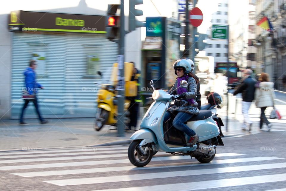 Woman on Vespa.