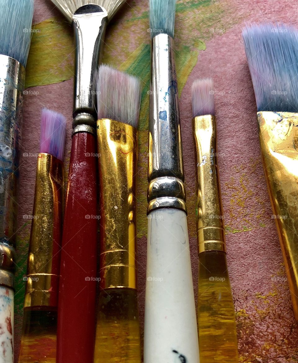 Closeup full frame of used paint brushes 