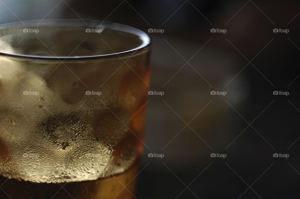 lemonade with ice in a misted glass