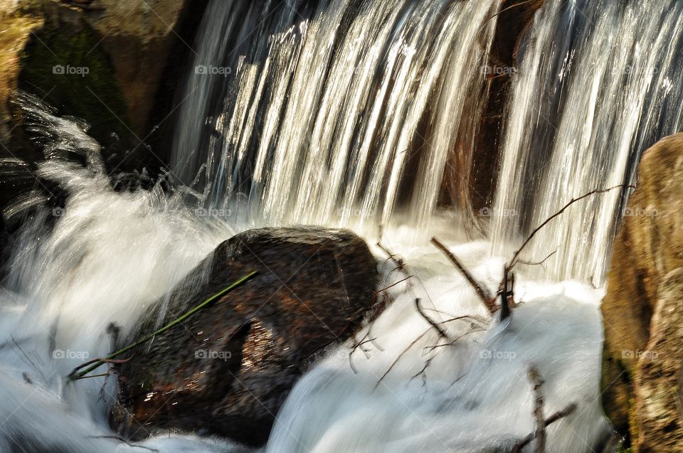 waterfall and river in the spring park in Poland