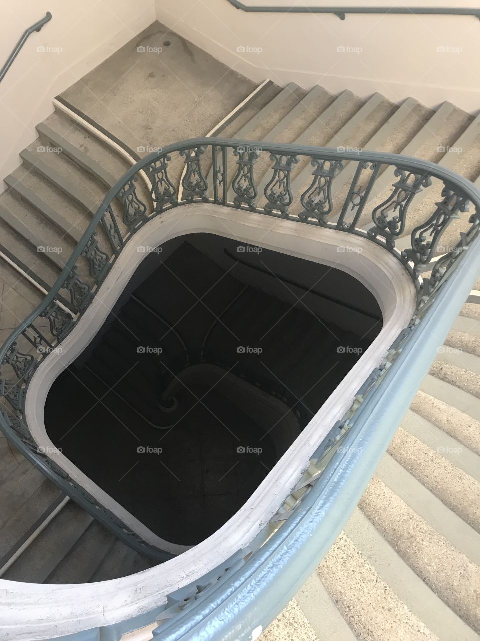 Top of a winding staircase, looking down