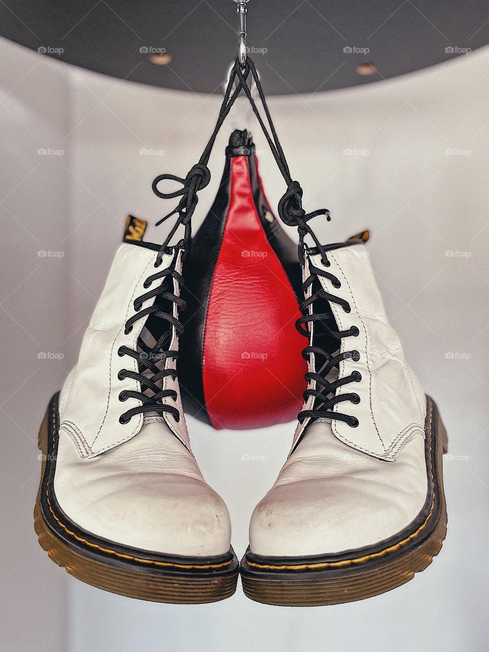 Doc Martens with speed bag, advertising for footwear, boots and boxing, fun product shots, Doc Martens on display 