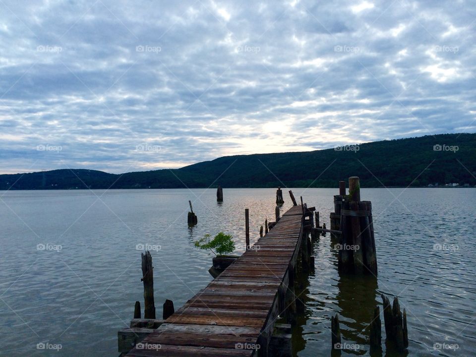 Abandoned Pier at Twilight. An old wooden pier in the gloaming of the Hudson River Valley