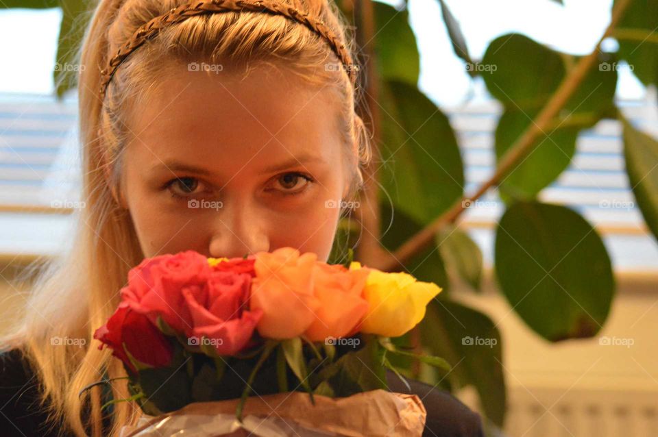 woman smelling flowers