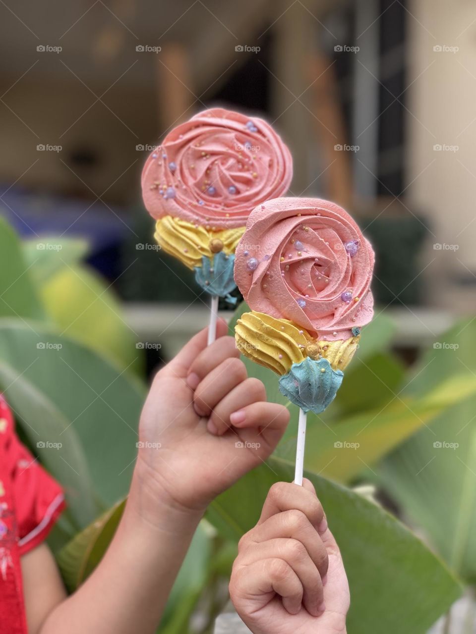 Children's hands holding beautiful candy.