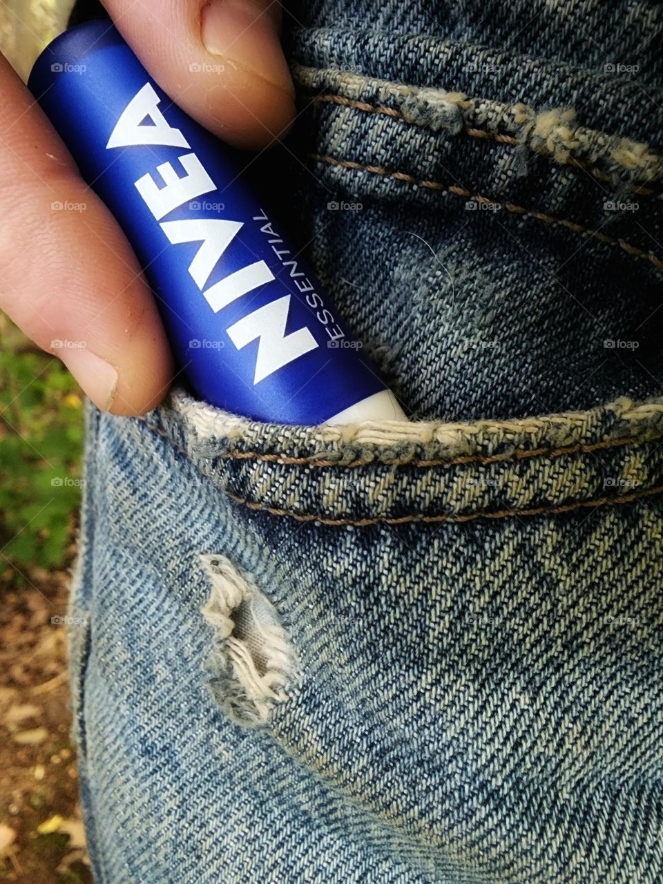 Bringing my Nivea essential lip chap with me in my jeans pocket.