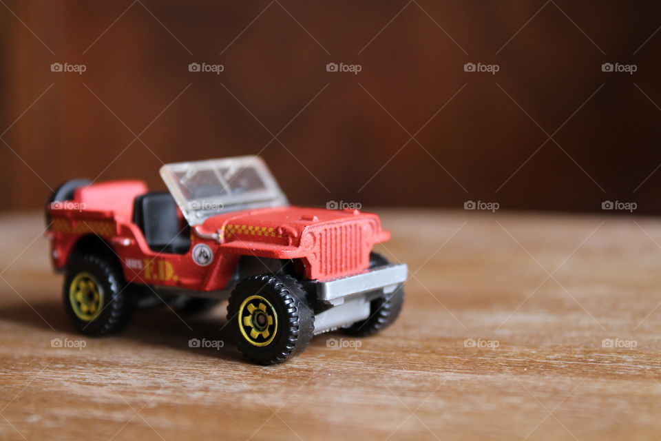 Jeep toy on wooden table