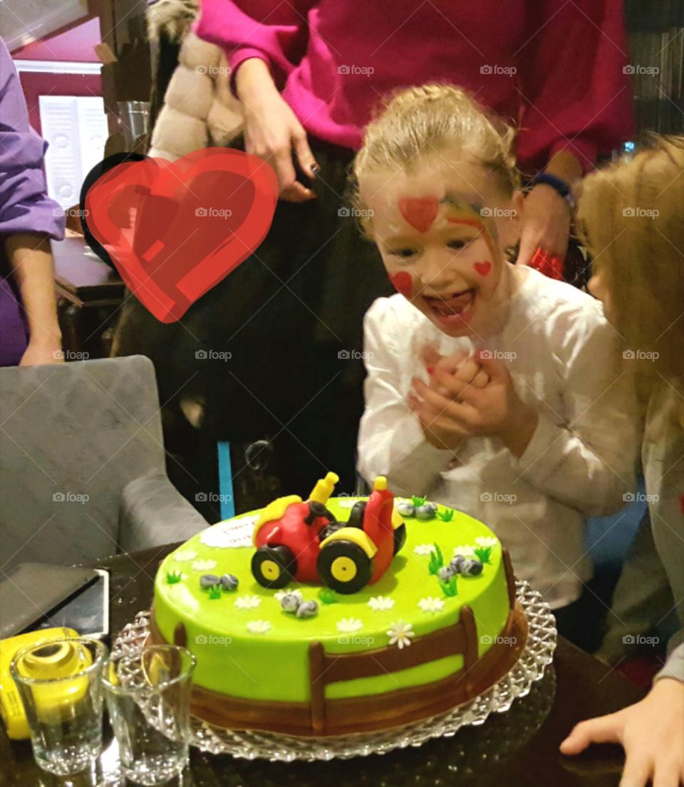 girl at the party very happy cake