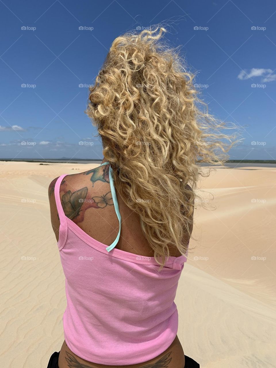 Woman with blonde hair with Tatoo 