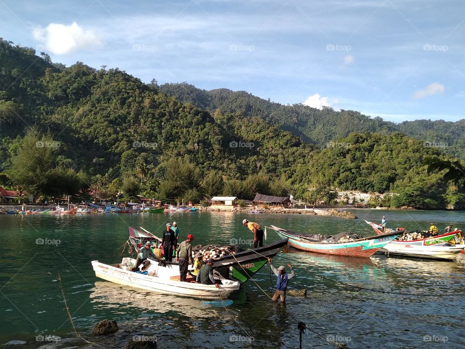 View of ships docked on the beach of Aceh, Indonesia.