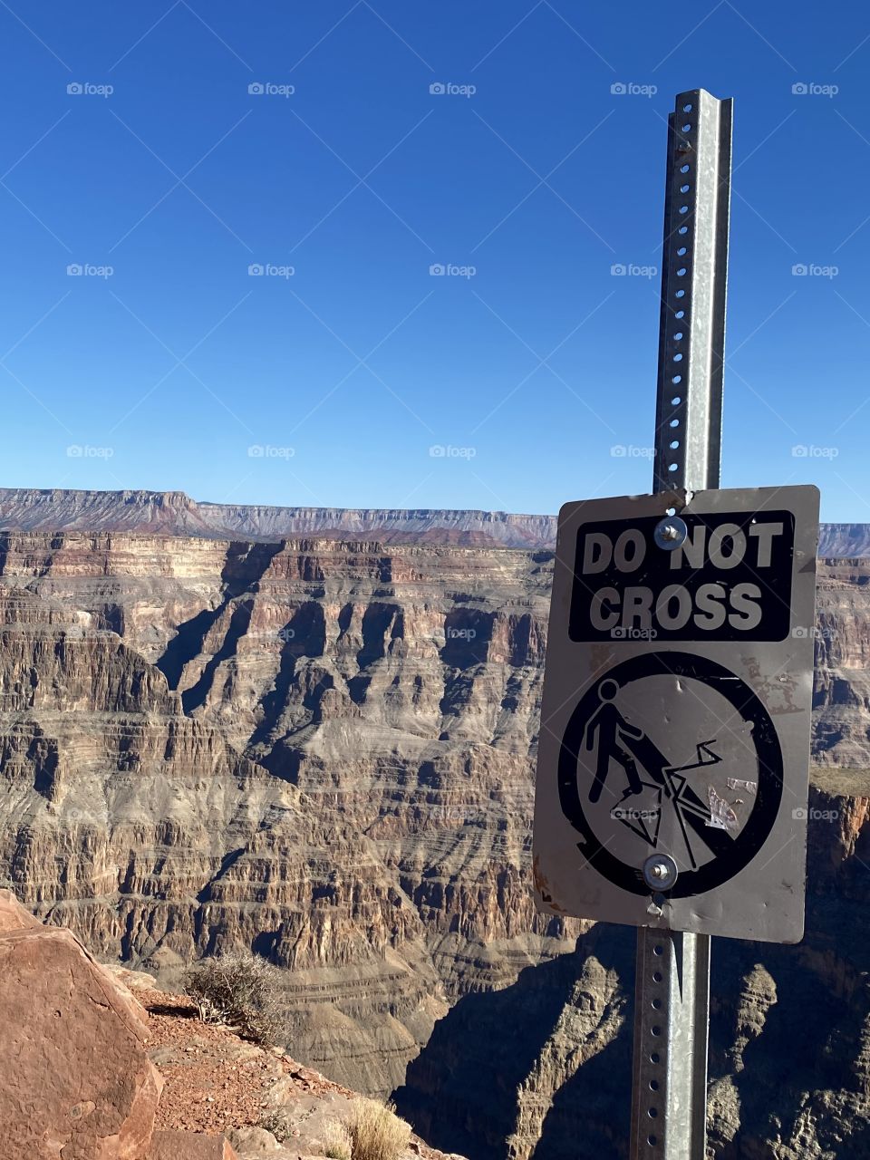 View of the Grand Canyon from Guano Point with a “Do Not Cross” sign in front of it 