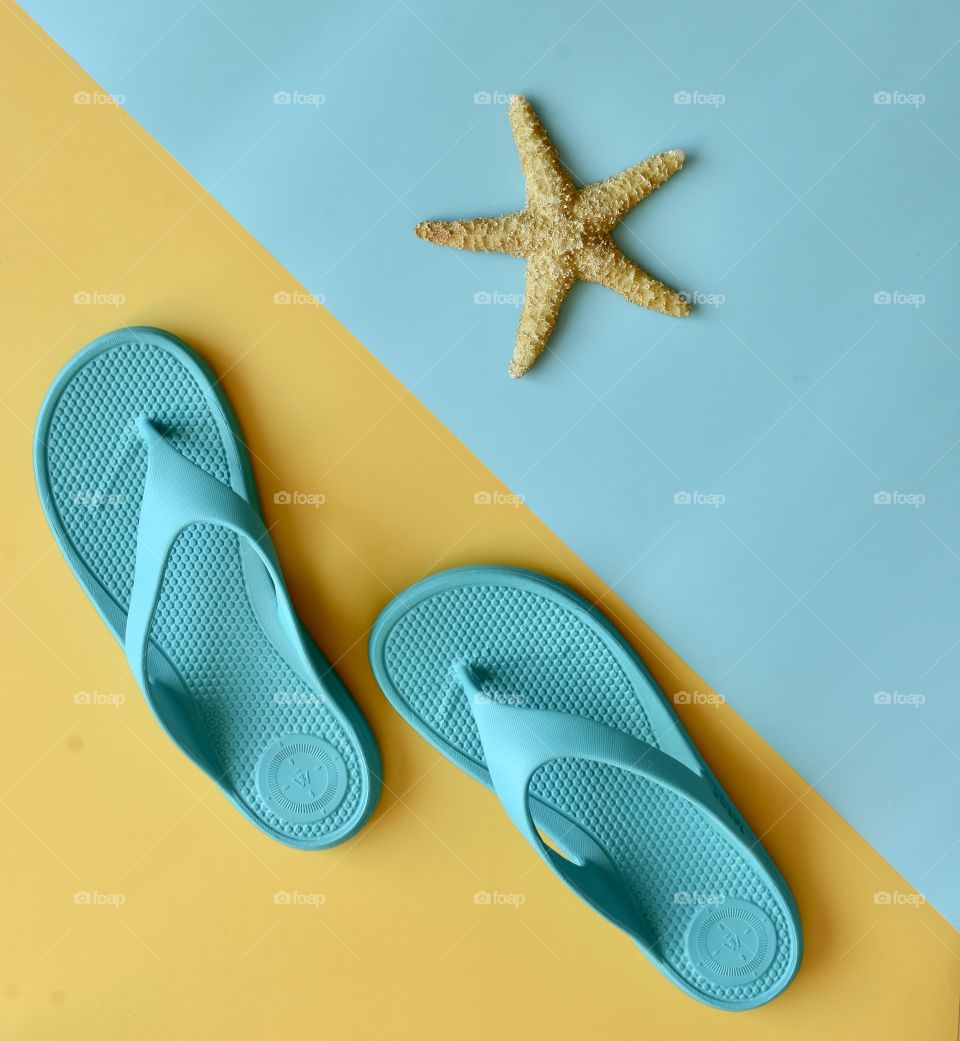 Totes flip flop sandals still life flat lay with starfish 