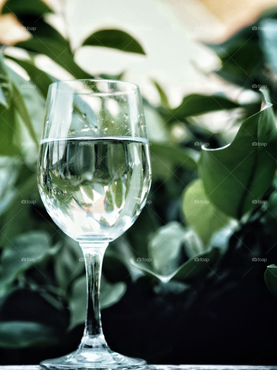 A glass of water filled almost the glass.